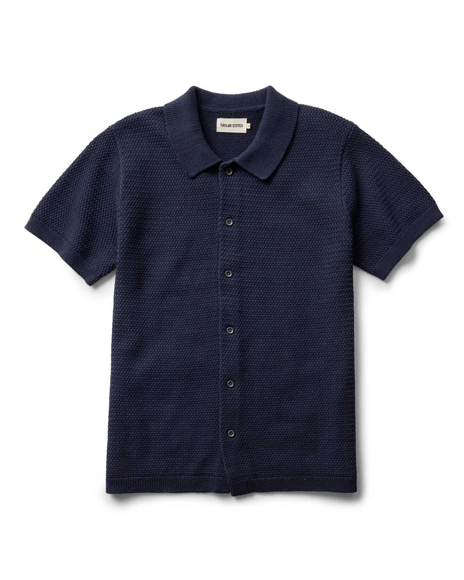 Navy short-sleeve button-up shirt on a white background